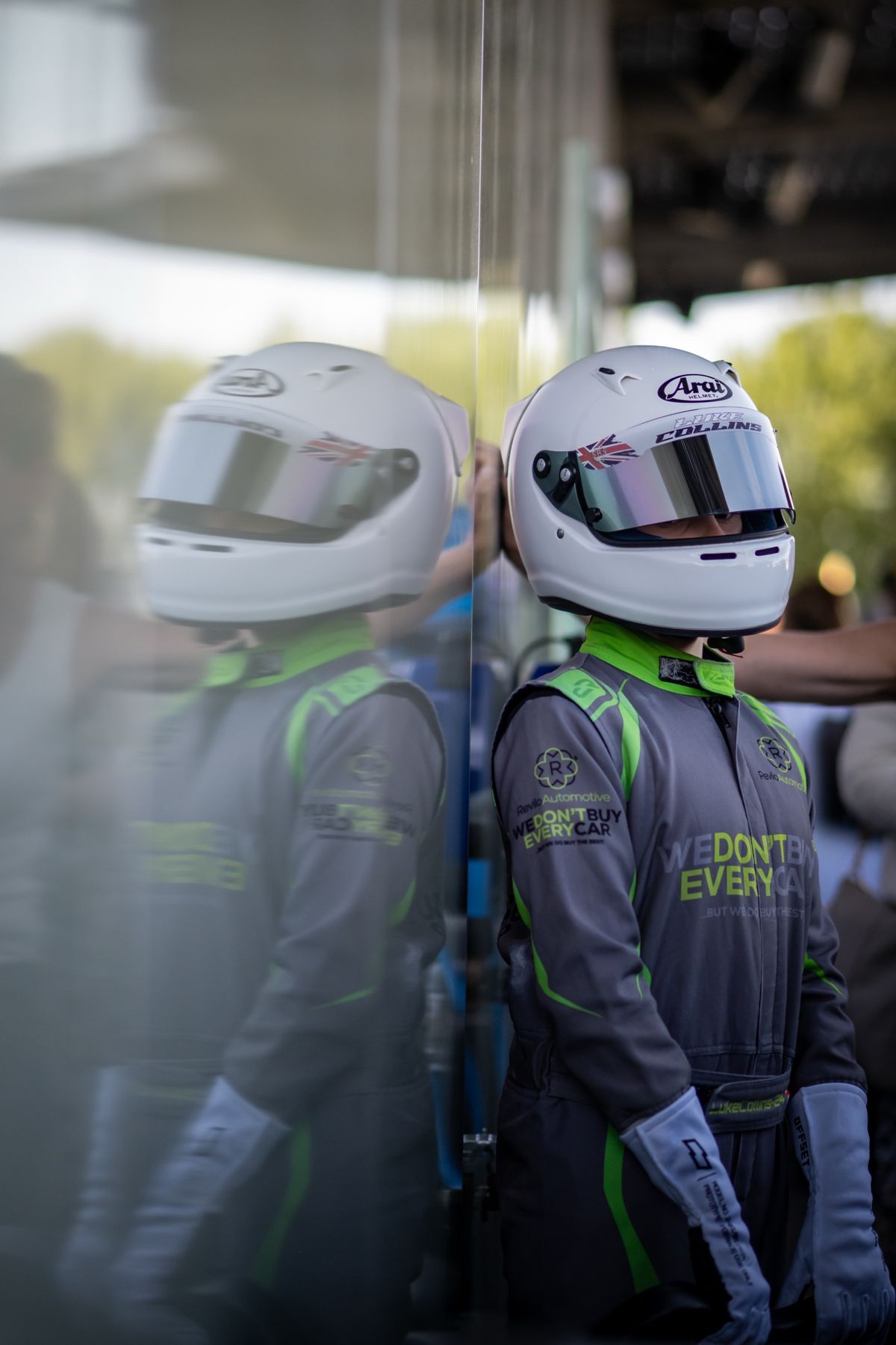 Luke in his helmet and race suit before a session